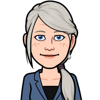 middle age woman with silver hair and blue eyes.